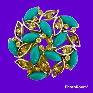 Bogoff Brooch. Blue plastic navettes and clear rhinestones set in silver tone.